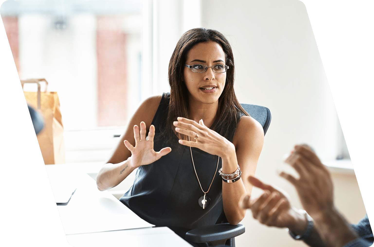 Woman and man talking in modern office.